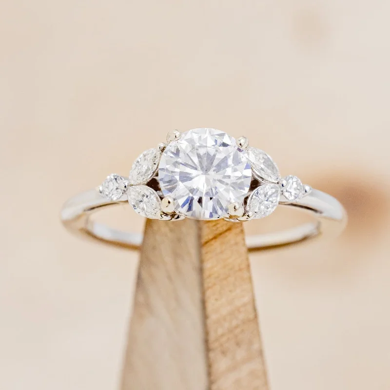 "BLOSSOM" - ROUND CUT MOISSANITE ENGAGEMENT RING WITH LEAFCUT DIAMOND ACCENTS