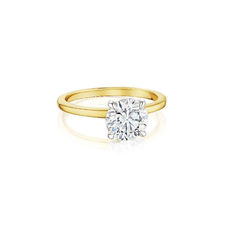 Fink's Exclusive Round Diamond Solitaire Ring in White and Yellow Gold