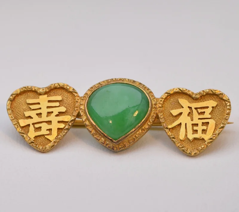 Vivid green Jadeite brooch in 18K yellow gold with Chinese characters